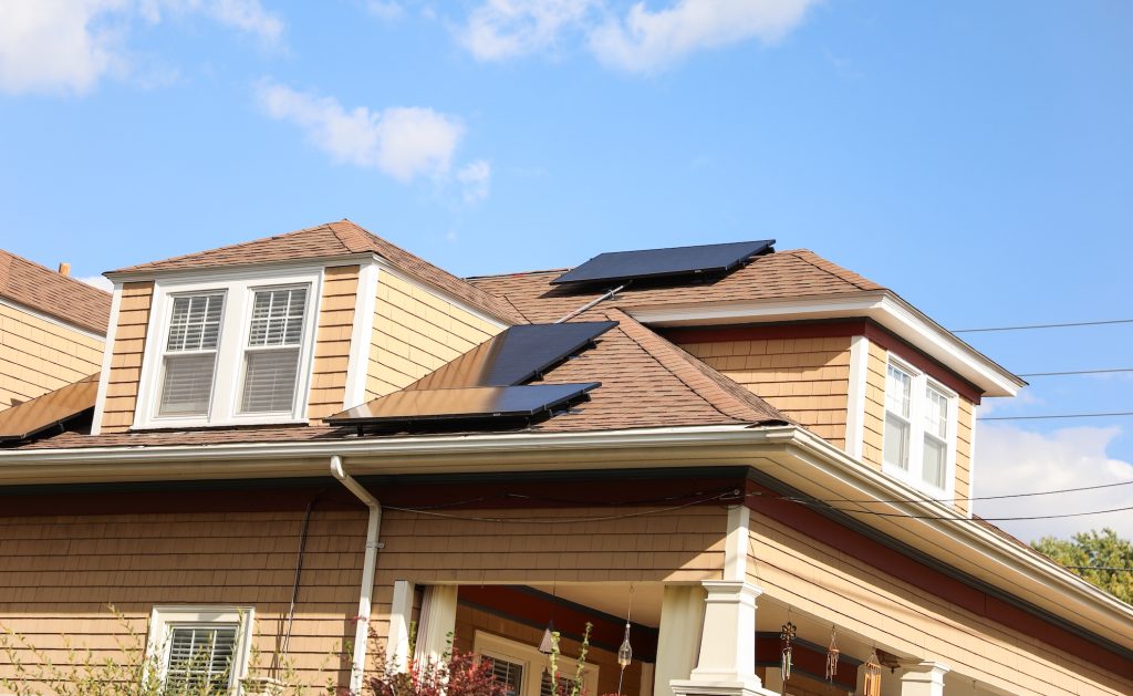 house with rooftop solar panels